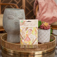 Load image into Gallery viewer, Pear Spice Fresh Scents scented sachet on woven tray with two planters.
