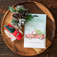 Load image into Gallery viewer, Merry Christmas Fresh Scents Scented Sachet on wooden tray with red toy truck and pine cones
