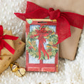 Load image into Gallery viewer, Red Door Wreath Fresh Scents scented sachet with wrapped present and Christmas bell
